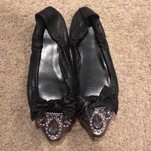Black flats, bejeweled around toe